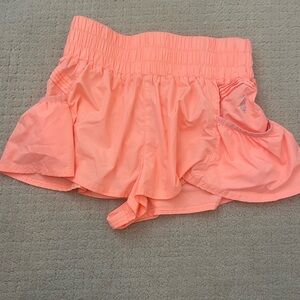 Get you flirt on free people movement orange shorts